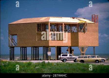 New home under construction on Texas Gulf of Mexico coast raised on stilts to prevent flooding from hurricane storm surge.   ©Bob Daemmrich Stock Photo