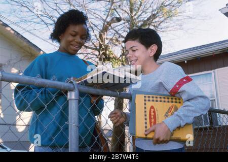 Austin Texas USA: Seventh-grade friends talking after school. MR ©Bob Daemmrich Stock Photo