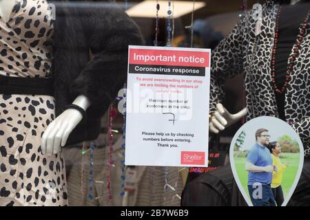 Glasgow, Scotland, UK. 18th Mar, 2020. restricted numbers to avoid overcrowding sign in window of Shelter Scotland shop in Glasgow during Coronavirus outbreak Credit: Kay Roxby/Alamy Live News Stock Photo