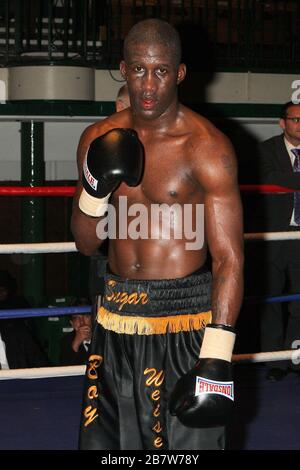 Ryan Toms (blue shorts) draws with Nathan Weise in a Light-Middleweight boxing contest at York Hall, Bethnal Green, promoted by Miranda Carter / Left Stock Photo