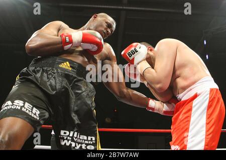 Dillian Whyte (black shorts) defeats Taya Mehmed (red shorts) in a Heavyweight boxing contest at Medway Park, Gillingham, promoted by Frank Maloney Stock Photo