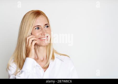 Mature woman talking on her cell phone Stock Photo