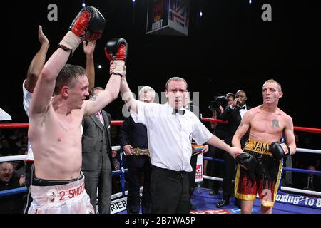 Jason Booth (white shorts) defeats Jamie Arthur in a Super-Middleweight contest for the British and Commonwealth Titles at the Brentwood Centre, promo Stock Photo