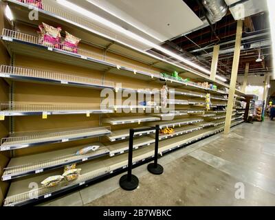Montecito, USA. 17th Mar, 2020. Santa Barbara, California, USA. 17th Mar, 2020. Empty grocery store shelves at Whole Foods is an unusual sight in upscale Santa Barbara, but becoming the norm during the Corona Virus/Covid-19 pandemic. Not a single roll of toilet paper was to be found at 10:00pm. Water, bread, milk, potatoes, meat, bananas, soup and other canned goods are the items most depleted, otherwise the shelves are full. The scarcity is already troubling shoppers, some who wear masks and gloves, and clerks are looking weary and stressed. Credit: Amy Katz/ZUMA Wire/Alamy Live News Credit:  Stock Photo