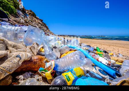 A pile of plastic water bottles and other waste on a Moroccan beach Stock Photo