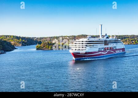 16 September 2018: Stockholm, Sweden - Viking Line ferry Grace sails into Stockholm Harbour just after sunrise.