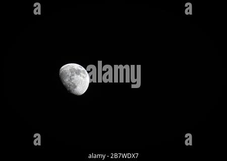 Waxing crescent moon against a black sky. Background for astronomy or spirituality Stock Photo