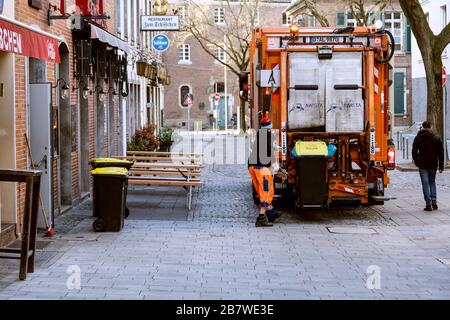 Due to the corona pandemic, the old town is almost empty during business hours, the garbage disposal works as usual Stock Photo