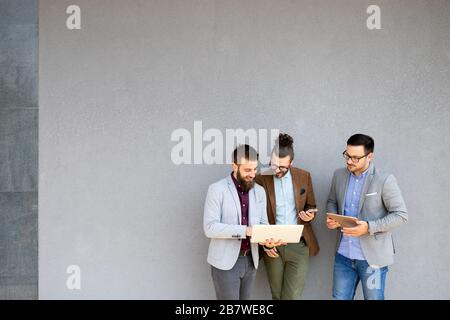 Business people, programmers cooperating at IT company developing apps Stock Photo