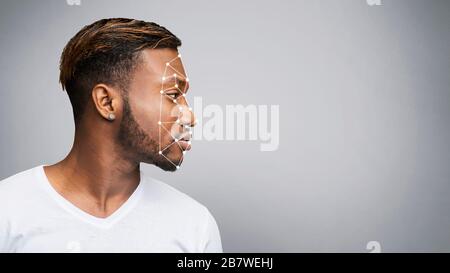African American man with identity verification grid on grey background, empty space. Panorama Stock Photo