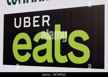 Bordeaux , Aquitaine / France - 11 07 2019 : Uber eats sign logo restaurant US international company shop food delivery bicycle driver with backpack Stock Photo