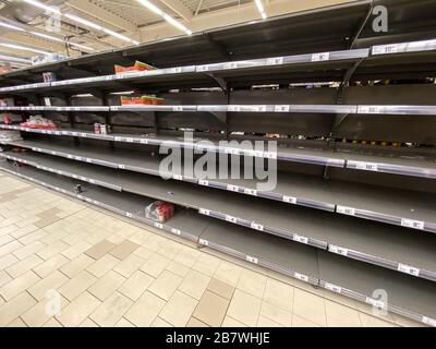 BUCHAREST, ROMANIA - MARCH 18, 2020: Panic Buyers And Food Cans Shortage In Supermarket Store Due To Coronavirus Pandemic Stock Photo