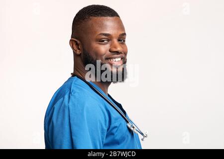 Profile portrait of african young doctor over white background Stock Photo