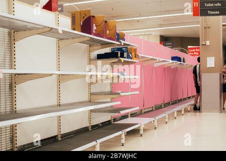 Empty store shelf of toilet paper in supermarket. Quarantine, coronavirus pandemia, covid-19. Stock Photo
