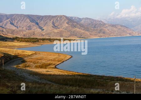 Toktogul Reservoir in the territory of the Toktogul district of the Jalal-Abad region of Kyrgyzstan. Stock Photo