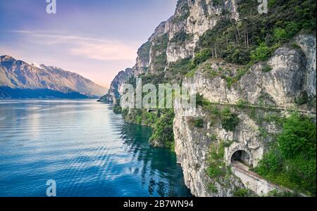 Beautiful landscape. View of Lake Garda and the Ponale trail carved into the rock of the mountain , Riva del Garda,Italy. Popular destinations for tra Stock Photo