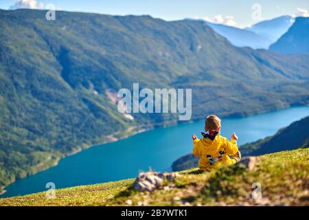 Aerial view over the beautiful Molveno town and Molveno lake, an alpine lake in Trentino, Italy Stock Photo