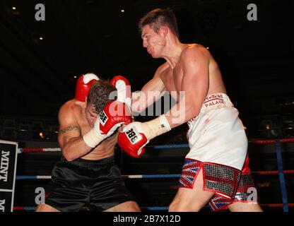 Jack Morris (white/red shorts) defeats Adam Wilcox in Super-Middleweight boxing contest at the Troxy, Limehouse, London, promoted by CityBoxer Stock Photo