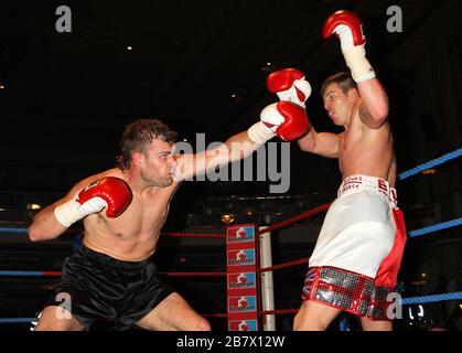 Jack Morris (white/red shorts) defeats Adam Wilcox in Super-Middleweight boxing contest at the Troxy, Limehouse, London, promoted by CityBoxer Stock Photo