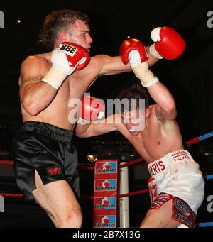 Jack Morris (white/red shorts) defeats Adam Wilcox in Super-Middleweight boxing contest at the Troxy, Limehouse, London, promoted by CityBoxer Stock Photo