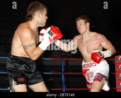 Jack Morris (white/red shorts) defeats Adam Wilcox in Super-Middleweight boxing contest at the Troxy, Limehouse, London, promoted by CityBoxer Stock Photo