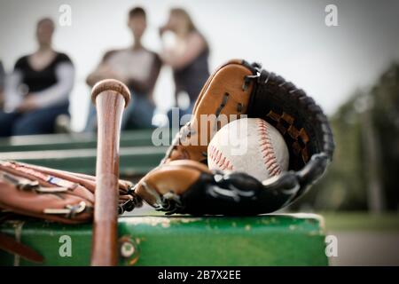 Leather baseball mitt with a baseball ball inside it. Stock Photo