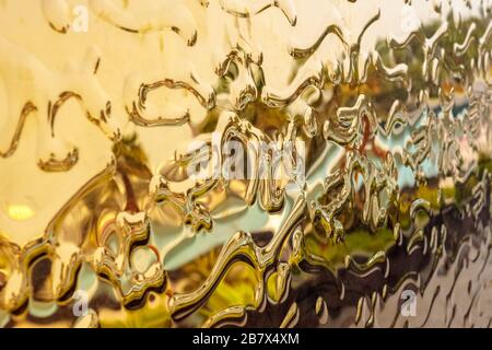 Gold Curved abstract metallic background. Abstract drops. texture Stock Photo