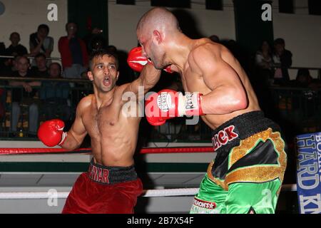 Adil Anwar (red/black shorts) defeats Nathan Graham in a Welterweight ...