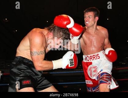 Jack Morris (white/red shorts) defeats Adam Wilcox in Super-Middleweight boxing contest at the Troxy, Limehouse, London, promoted by CityBoxer Stock Photo