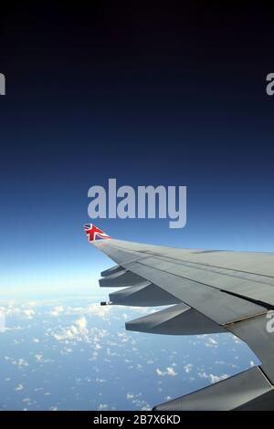 Boeing 747-400 (744) in flight view Through Aeroplane Window Stock Photo