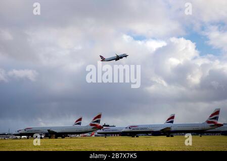 Glasgow Airport, Renfrewshire, Scotland, UK. 18th March 2020  With air travel limited across Europe and beyond by the Coronavirus outbreak British Airways lie parked up at Glasgow Airport. Stock Photo