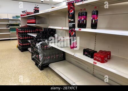 Empty shelves in a Sainsburys store on March 18, 2020 in Upton, Wirral, United Kingdom. Spates of 'panic buying' have cleared supermarket shelves of g Stock Photo