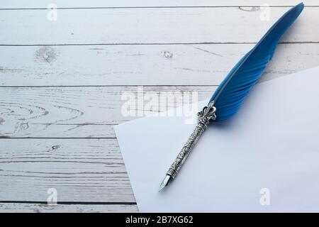 Old fountain pen and paper on white background Stock Photo