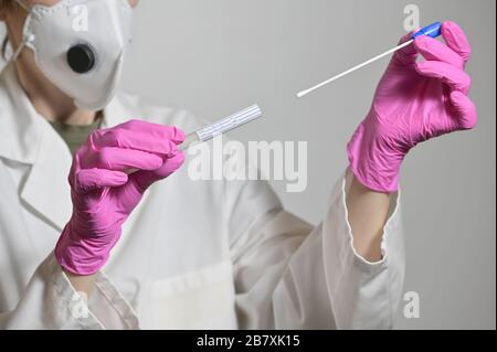 Nurse Holds A Swab For The Coronavirus / Covid19 Test Stock Photo