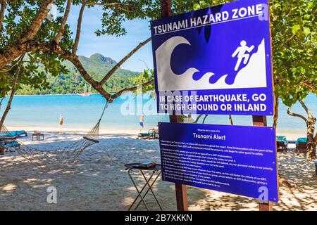 Tsunami hazard zone warning sign on the beach at Ardaman Sea, Langkawi, Malaysia, Asia Stock Photo