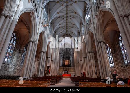 The interior of the Gothic style Nave at York Minster in York, Britain. The Nave is one of the widest in Europe. The Minster is the second largest G Stock Photo