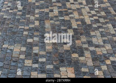 Ancient paving stones made of rectangular stone bricks. Textured background. Stock Photo