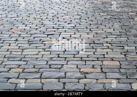 Ancient paving stones made of rectangular stone bricks. Textured background. Stock Photo