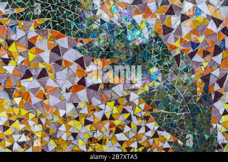 Close up view of colorful mosaic on building wall. Street arts concept. Beautiful backgrounds. Stock Photo