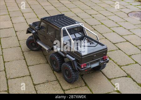 View of radio controlled model  racing car on off-road background. Toys with remote control. Free time. Children and adults concept. Stock Photo