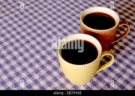 Two Cups of Hot Black Coffee Isolated on the Table with Copy Space Stock Photo
