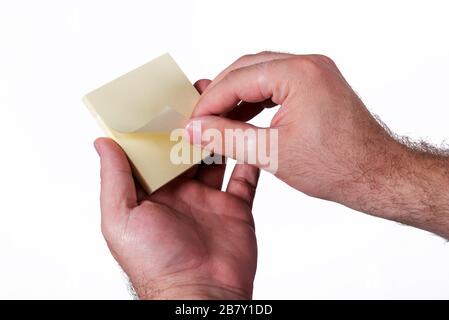 Hands holding up yellow notes Stock Photo