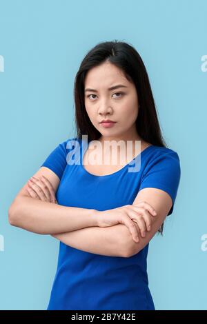 Freestyle. Chinese woman naked standing isolated on grey posing sensual