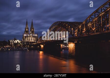 Cologne Cathedral and Hohenzollern Bridge at Night Stock Photo