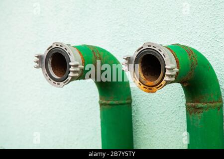 Fire hydrant nozzle green, close-up hose connection Stock Photo