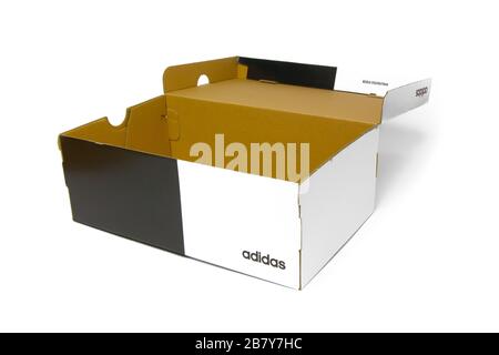 Opened empty Adidas box. Blank and white shoes box on a white background. San Francisco, USA, March 2020. Stock Photo