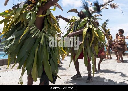 dh Port cruise ship welcome WEWAK PAPUA NEW GUINEA Traditional PNG native dancers dressed as Bird of Paradise welcoming people Stock Photo