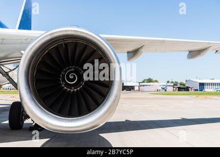 Engine and a wing of an aircraft plane. Airline and travelling concept. Stock Photo