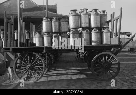 Milk cans at Railroad station. Minot, North Dakota, USA,  John Vachon for U.S. Farm Security Administration, October 1940 Stock Photo
