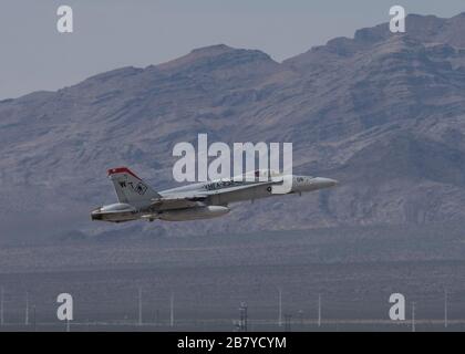 An F/A-18C Super Hornet multi-role combat jet assigned to Marine Fighter Attack Squadron 232 (VMFA-232) at Marine Corps Air Station Miramar, California, takes off from Nellis Air Force Base, Nevada, March 9, 2020. During Red Flag 20-2, participants perform in a multi-domain environment that combines several U.S. Air Force units, joint partners and foreign allies into one fighting force. (U.S. Air Force photo by Airman 1st Class Bryan Guthrie) Stock Photo